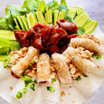 Grilled Pork with Steamed Rice Vermicelli Bundles and spring rolls